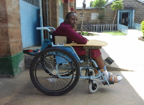 Photo of Christine in her new wheelchair