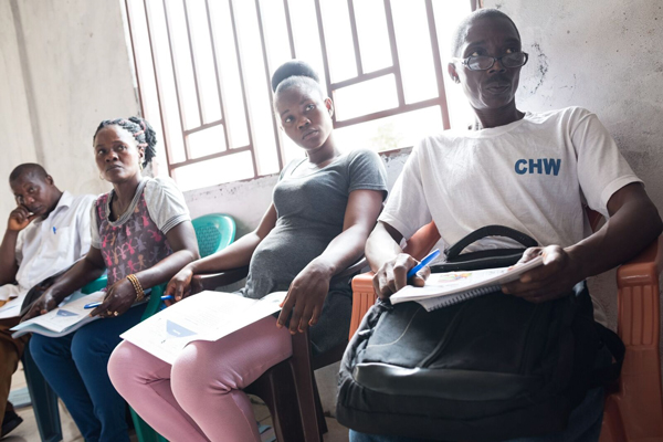 Photo of people in a CHW training session in Sierra Leone. Credit: Joshua Yospyn/JSI