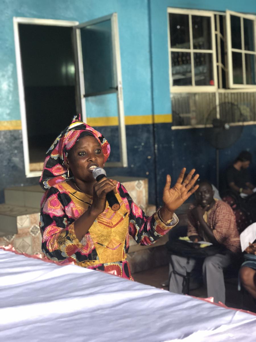 Isatu Bangura tells her fellow learners at the SLAES Literacy Class graduation ceremony how she feels empowered and now wants to continue her education.