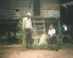 Photo of Hout Thoeung outside in a wheelchair