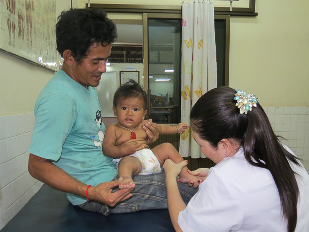 Ms. Sokunthy conducts assessment performance for Meth Panhasak, a 6-month-old male with clubfoot, in the Kien Khleang clinic
