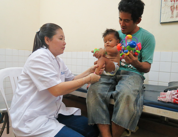 Ms. Sokunthy performs a manipulation technique to correct bilateral foot deformities