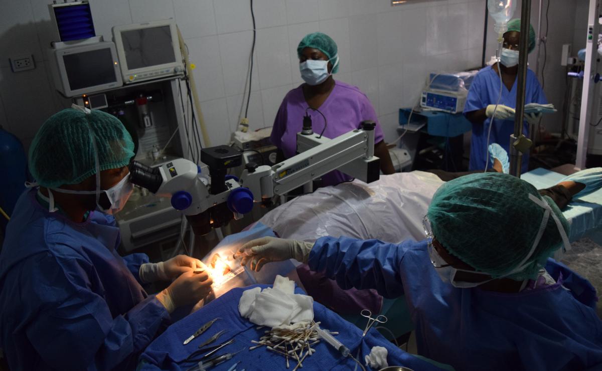 Dr. Udofia conducting surgery on a patient.