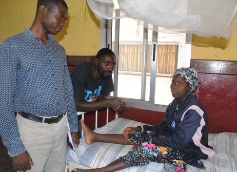 Mariatu Conteh (right) received life-saving dialysis under the Free Health Care Initiative with the help of Referral Coordinator Momoh Brima (left).
