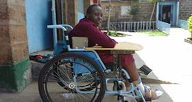 Photo of Christine in a wheelchair