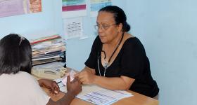 Photo of health provider Dr. Sonia Ramirez at the CEPROSH clinic seeing a patient